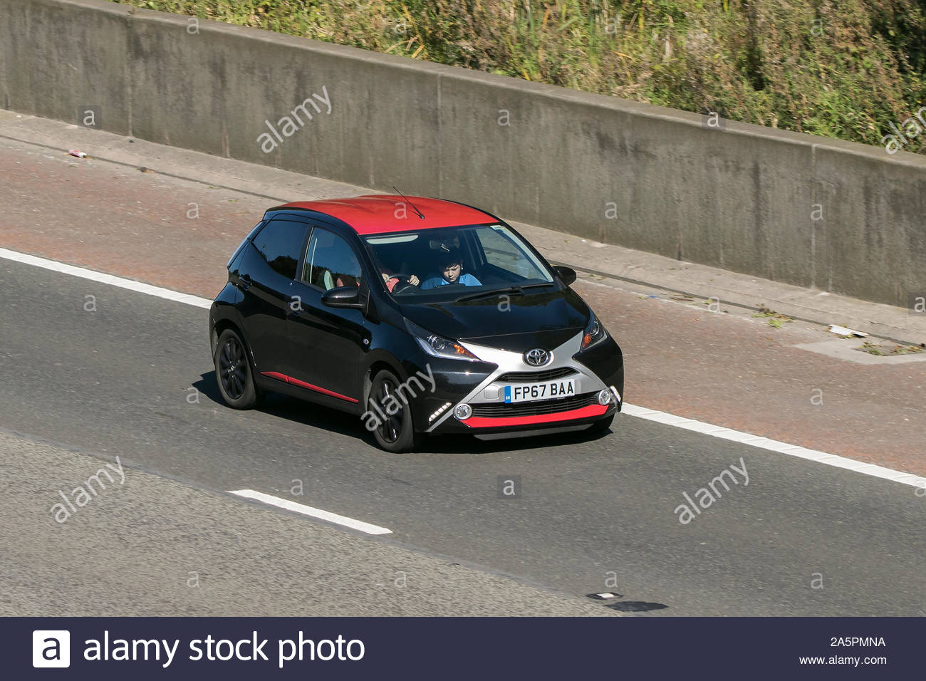 2017 black red toyota aygo x press vvt i vehicle travelling on the m6 motorway near preston in lancashire uk 2A5PMNA