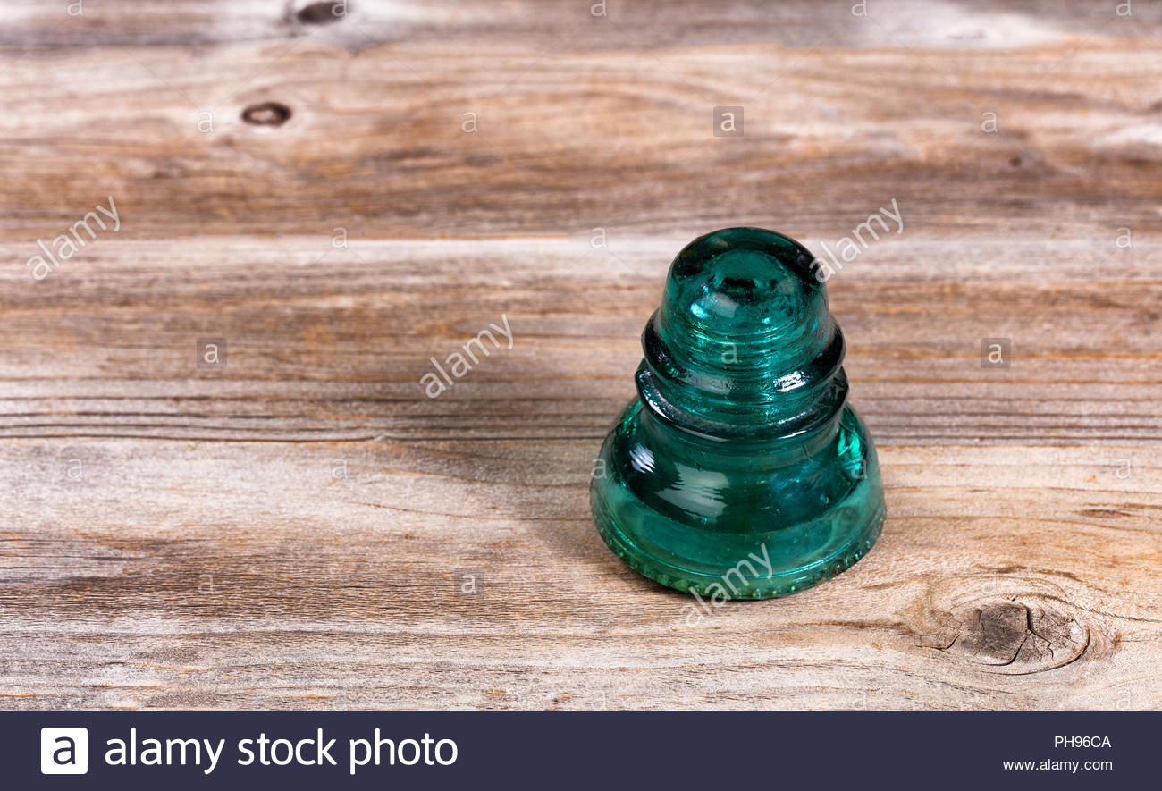 antique glass insulator on rustic wooden boards PH96CA