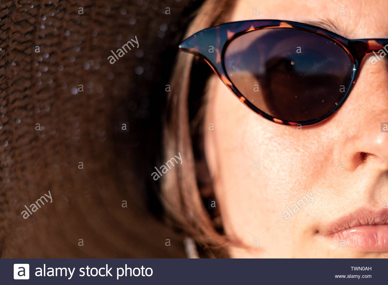 young woman wearing a summer hat and sunglasses close up portrait summer vacation sunny weather holiday mood concept young girls head with frec TWN0AH