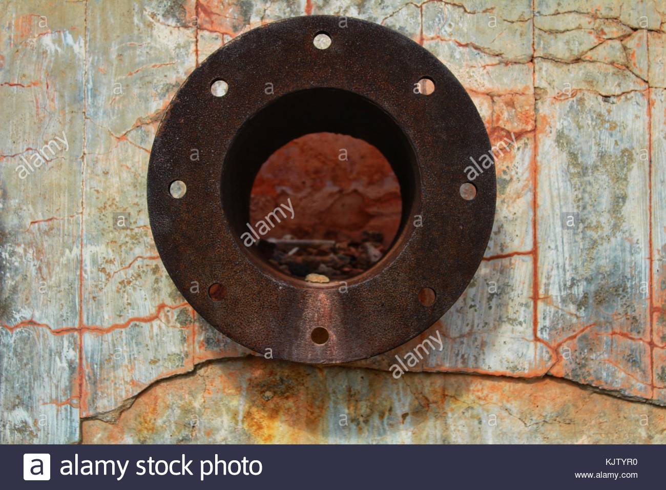 rusty pipe on stone KJTYR0