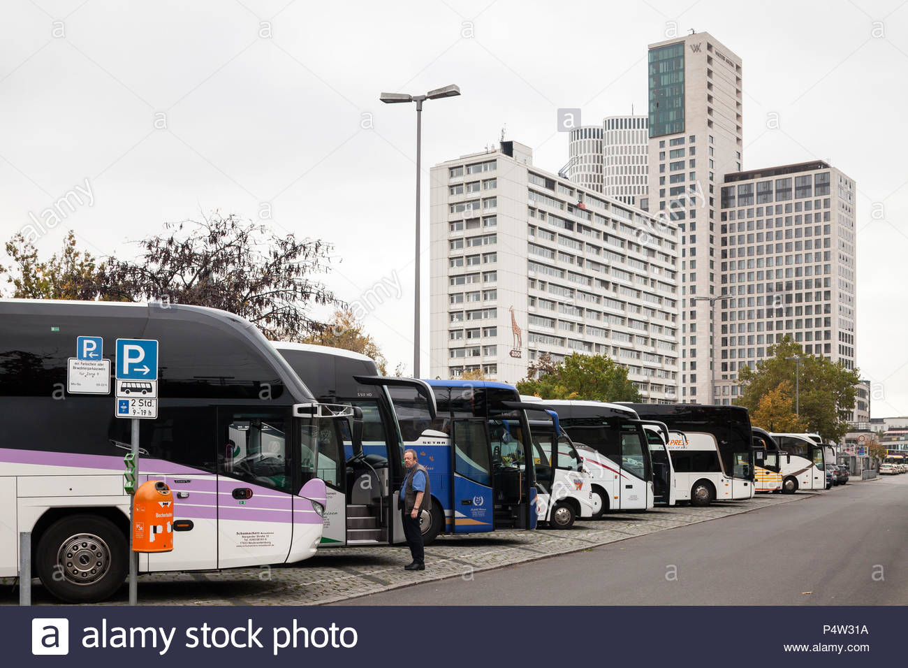 berlin germany coaches park at the zoologischer garten station on hardenbergplatz in berlin charlottenburg in the background the tower zoofenster berlin and the upper west P4W31A