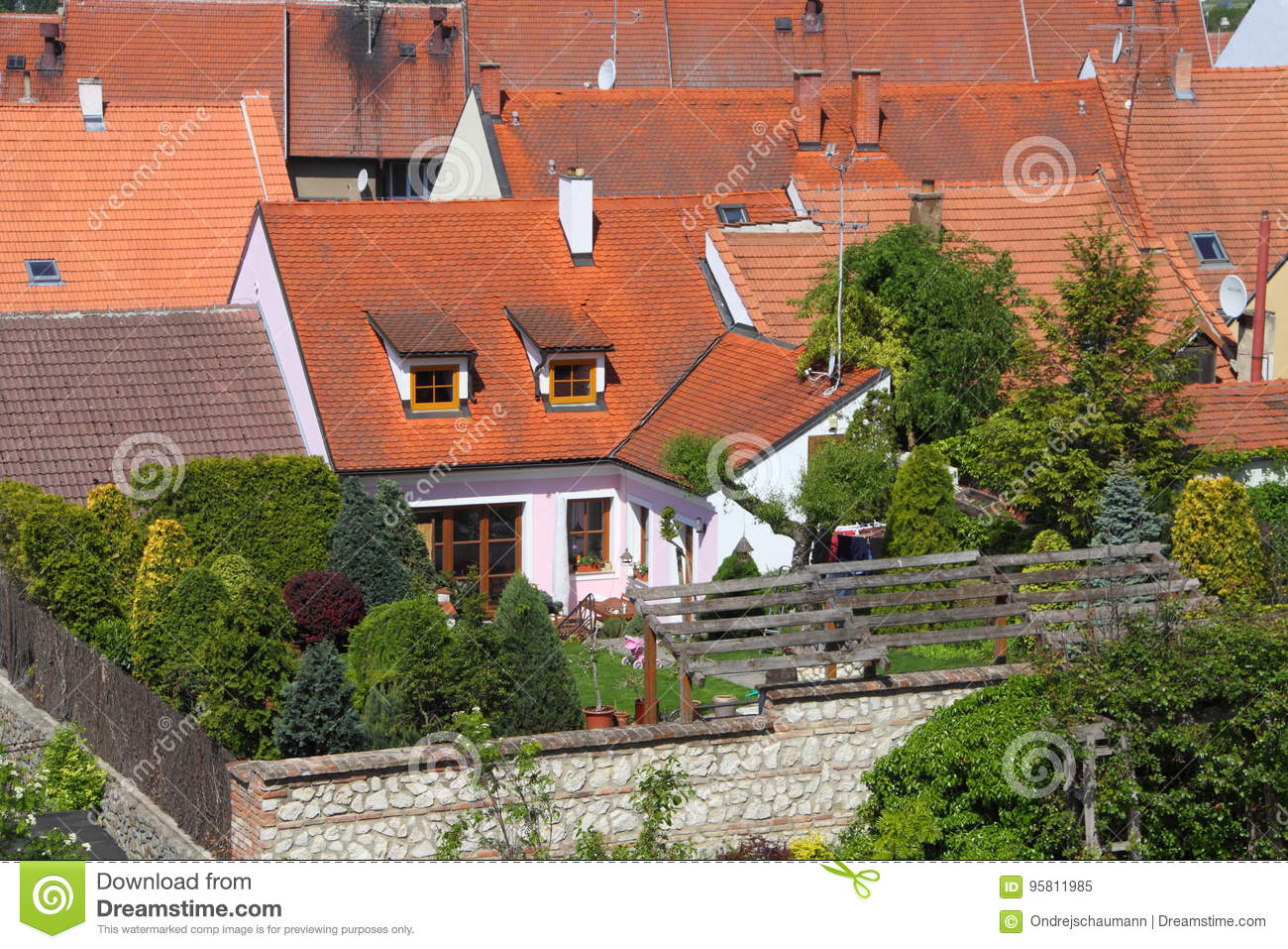 detail od small red roofed house tiny garden roof above