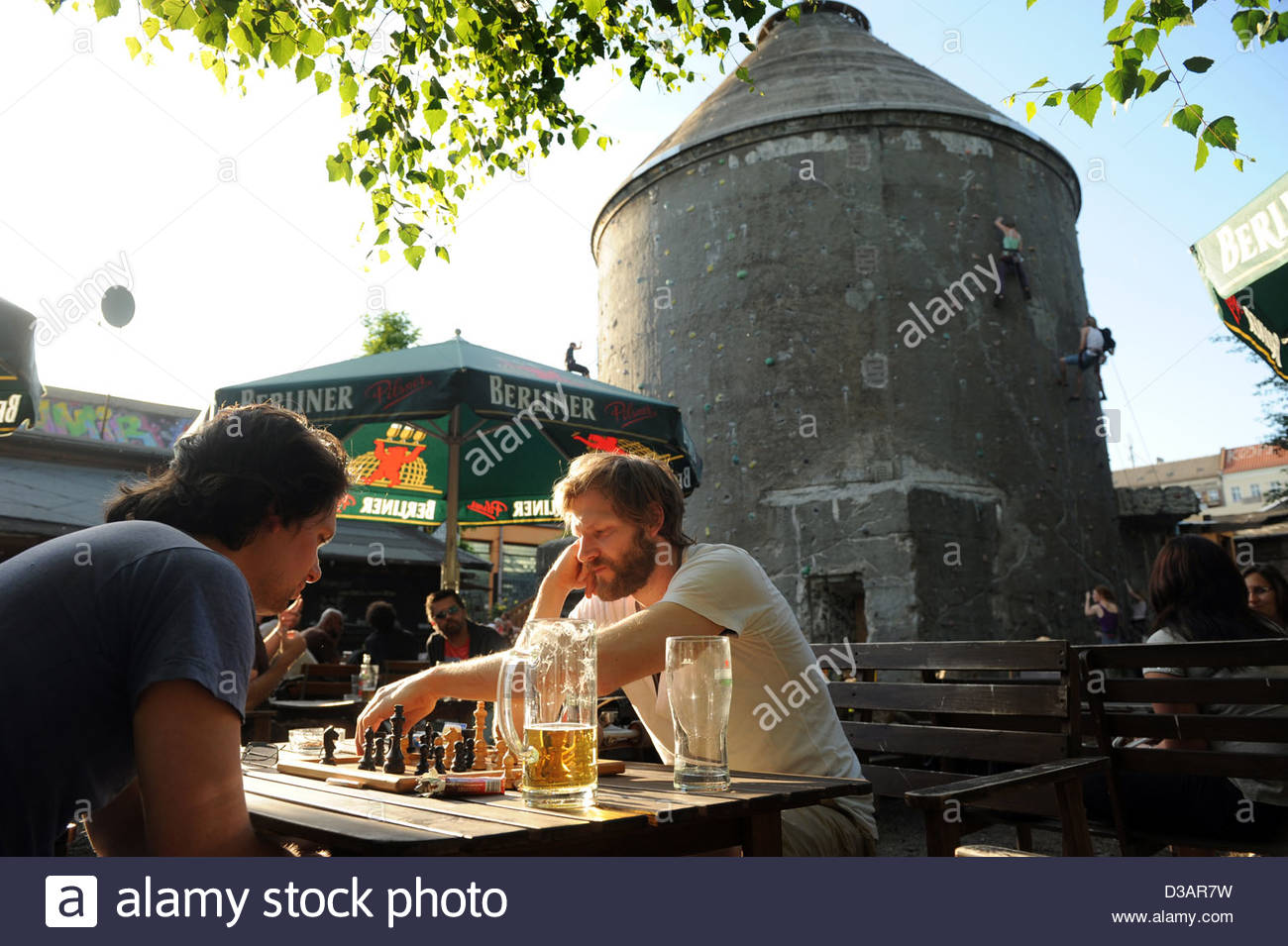 berlin germany men in the beer garden on the cassiopeia raw terrain D3AR7W